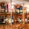 Ceiling & wall mounted Studio style Bistro Designer Shelving in polished brass with glass shelves