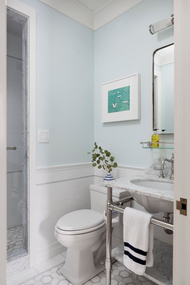 Studio style Vanity Leg System in polished nickel with a marble shelf supported by Rail style Shelf Supports