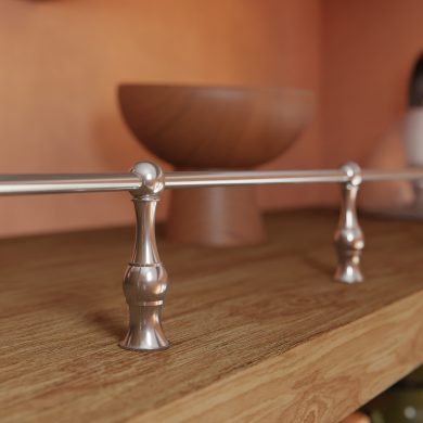 Traditional style Gallery Rails in polished nickel mounted on a wood shelf