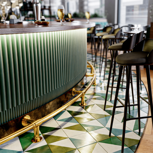 a Curved Foot Rail in polished brass with Studio style floor and wall mountings