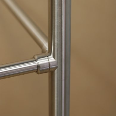 Coped Fitting of a Metro style Vanity Leg System in satin nickel