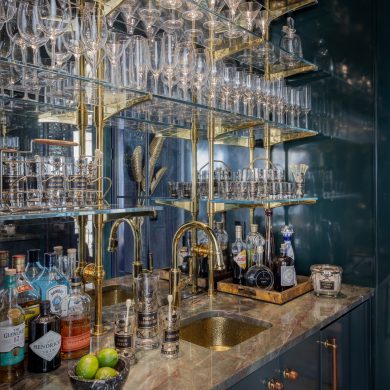 Counter, Wall & ceiling mounted Rack style Cantilever Designer Shelving featuring Ball style wall mounts and Solid style Rack Arms in polished brass