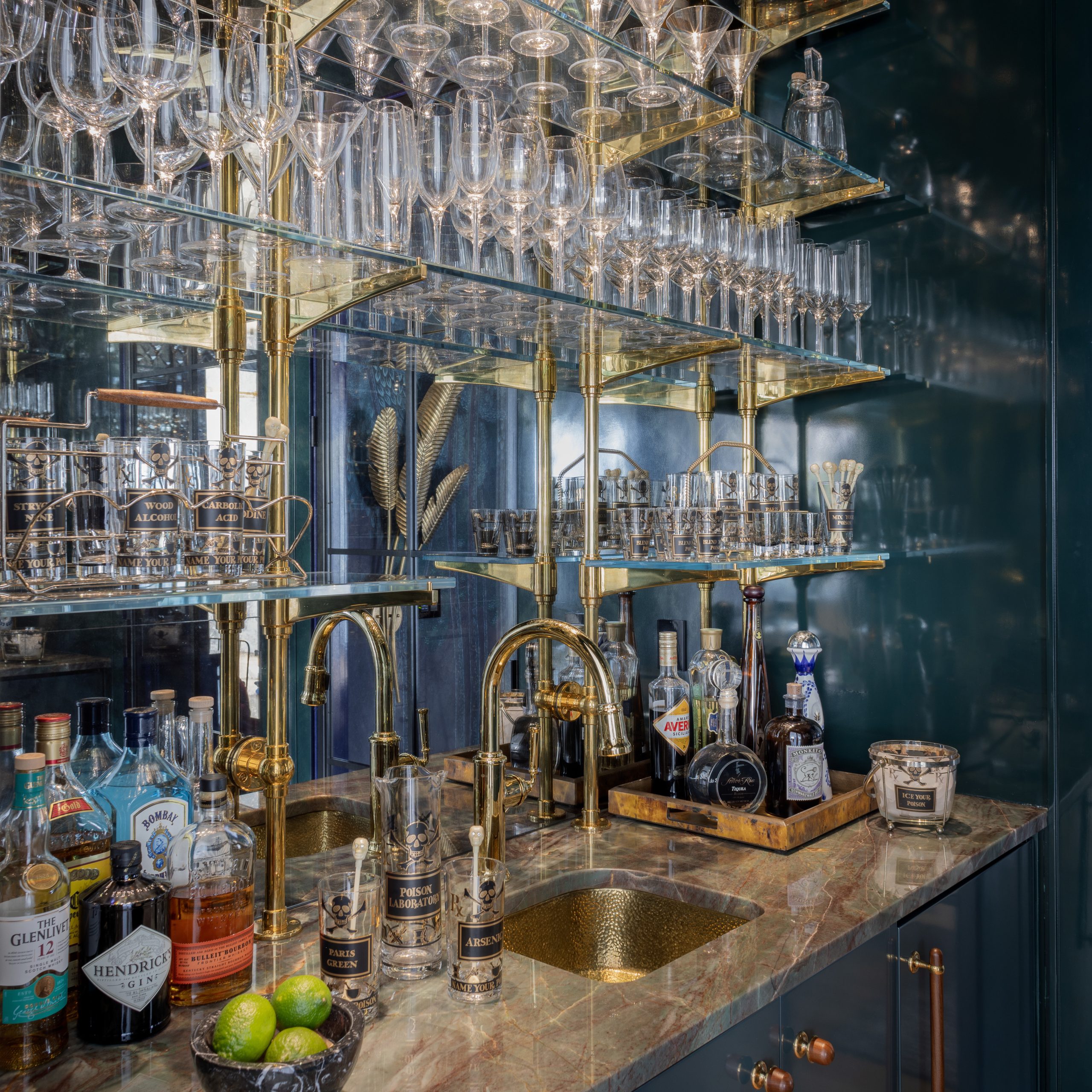 Counter, Wall & ceiling mounted Rack style Cantilever Designer Shelving featuring Ball style wall mounts and Solid style Rack Arms in polished brass