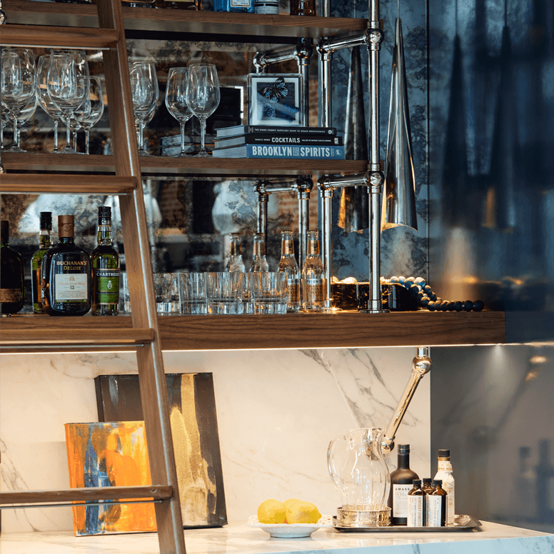 Signature Designer Bracket Shelving supporting a wood shelf with a Counter-mounted Ball style Bistro shelving above