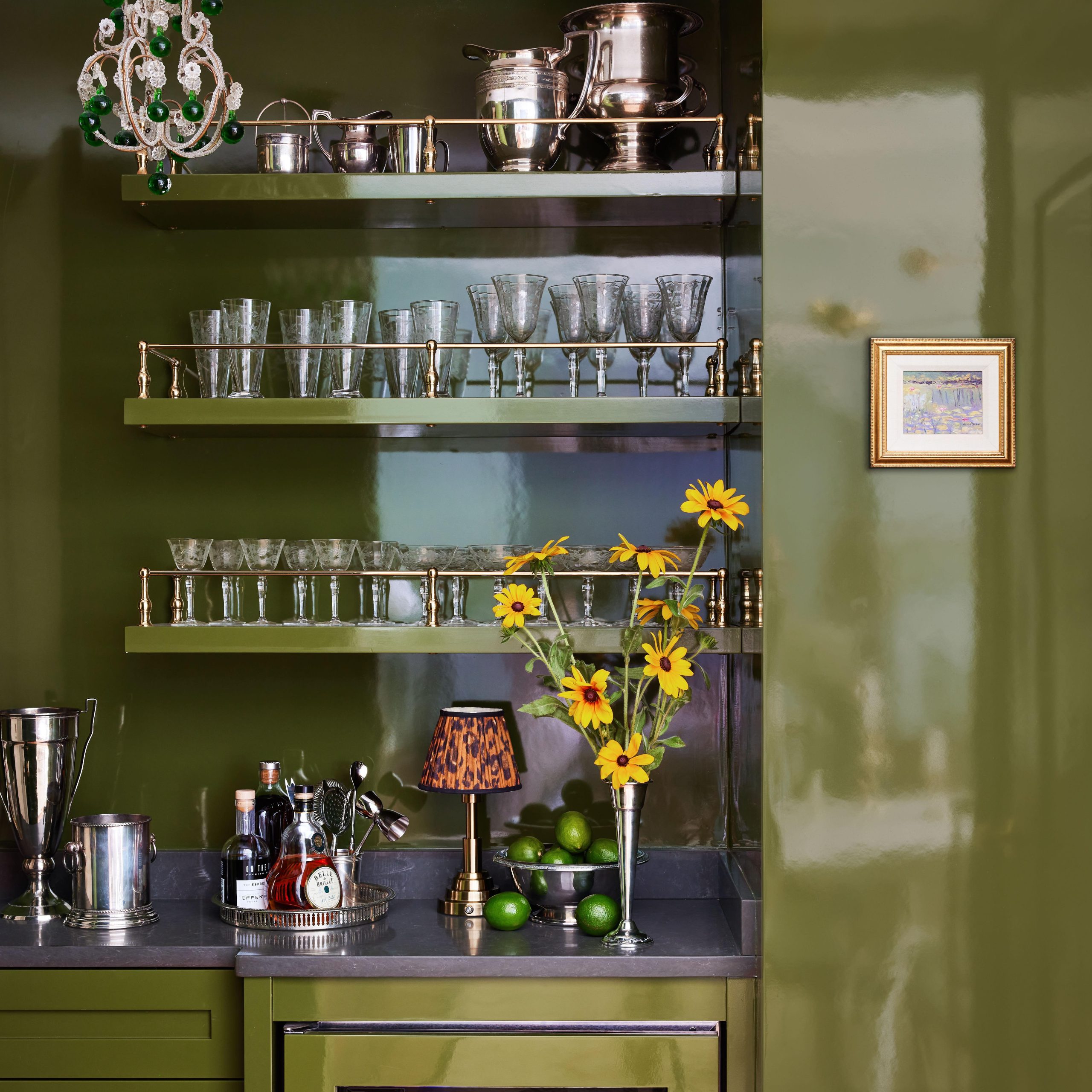 Traditional style Gallery Rails in polished brass on wood shelves