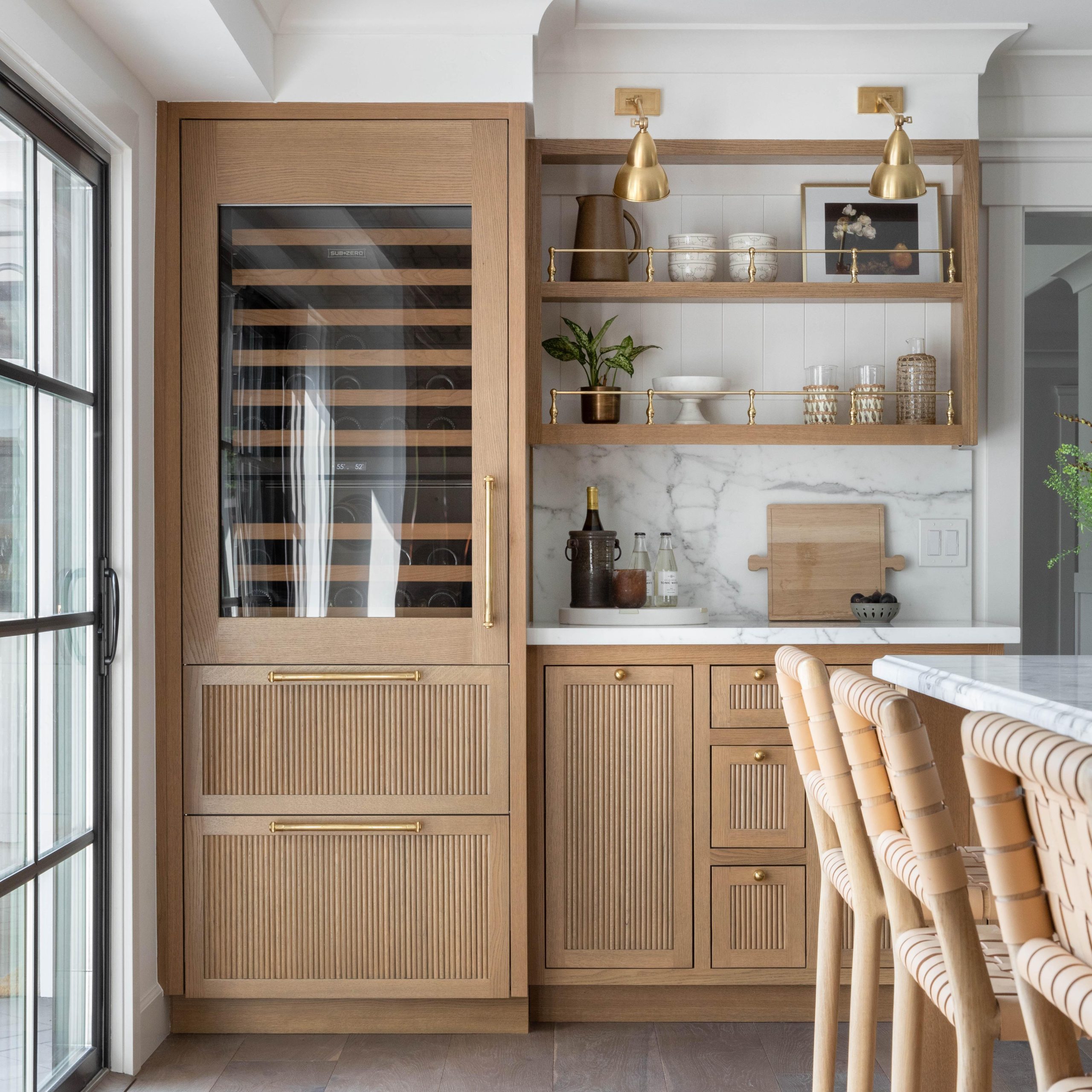 Traditional style Gallery Rails in polished brass on woos shelving
