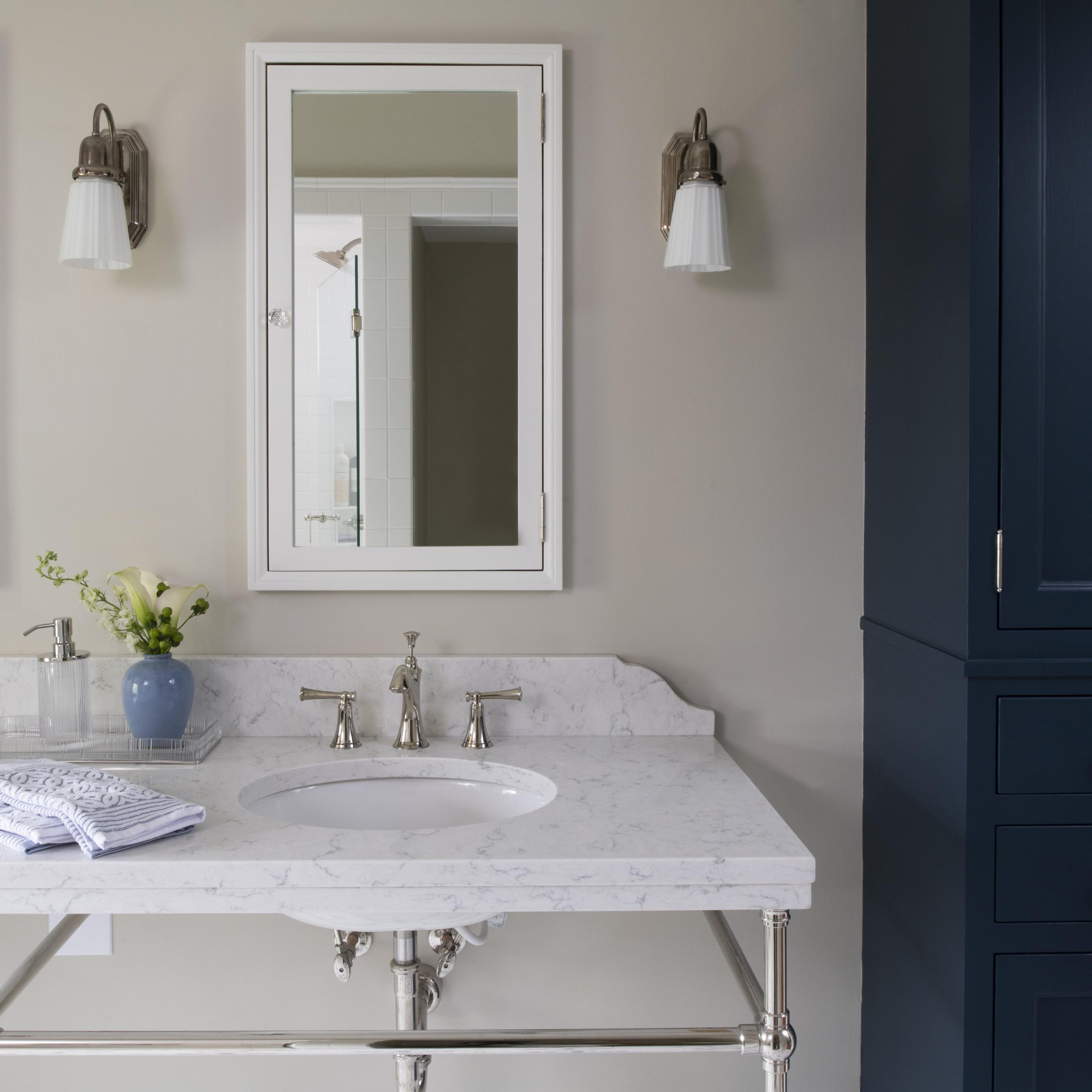Ball Foot style Vanity Leg System in polished chrome with marble top