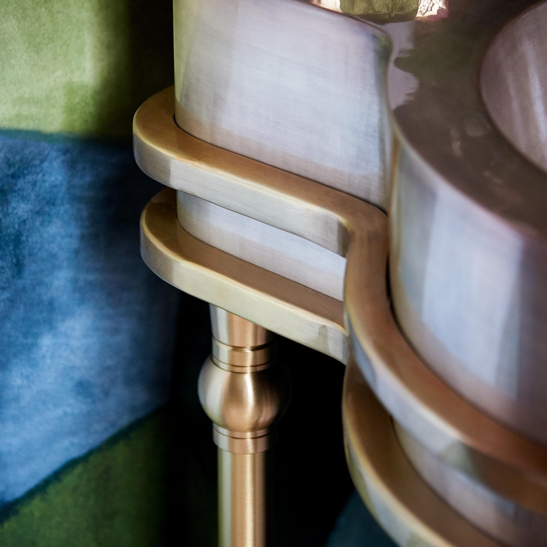 Detal of a Modern style Vanity Leg System in satin brass with a Thompson Traders sink by Kara Cox