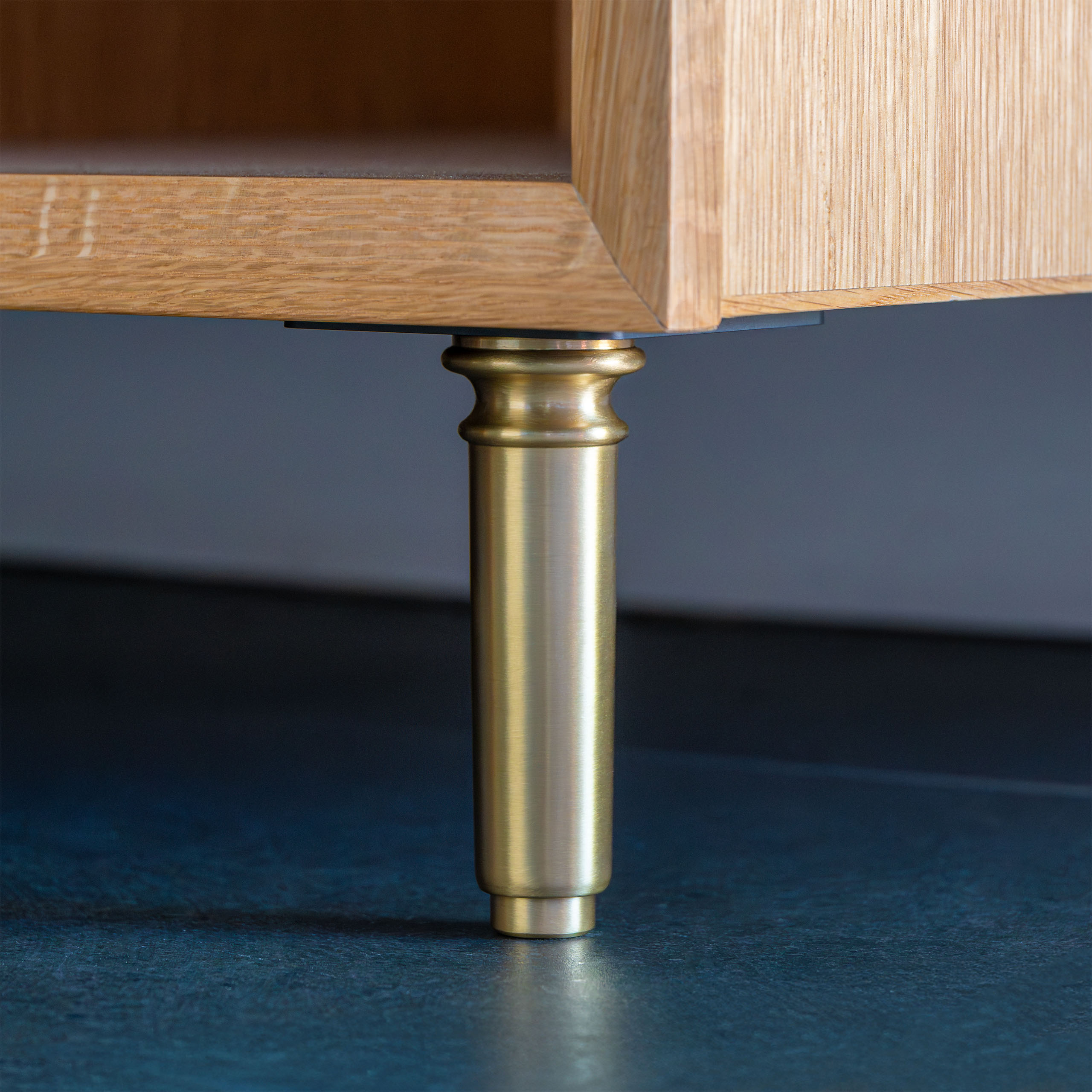 a Providence style Furniture Foot in satin brass with a mounting plate