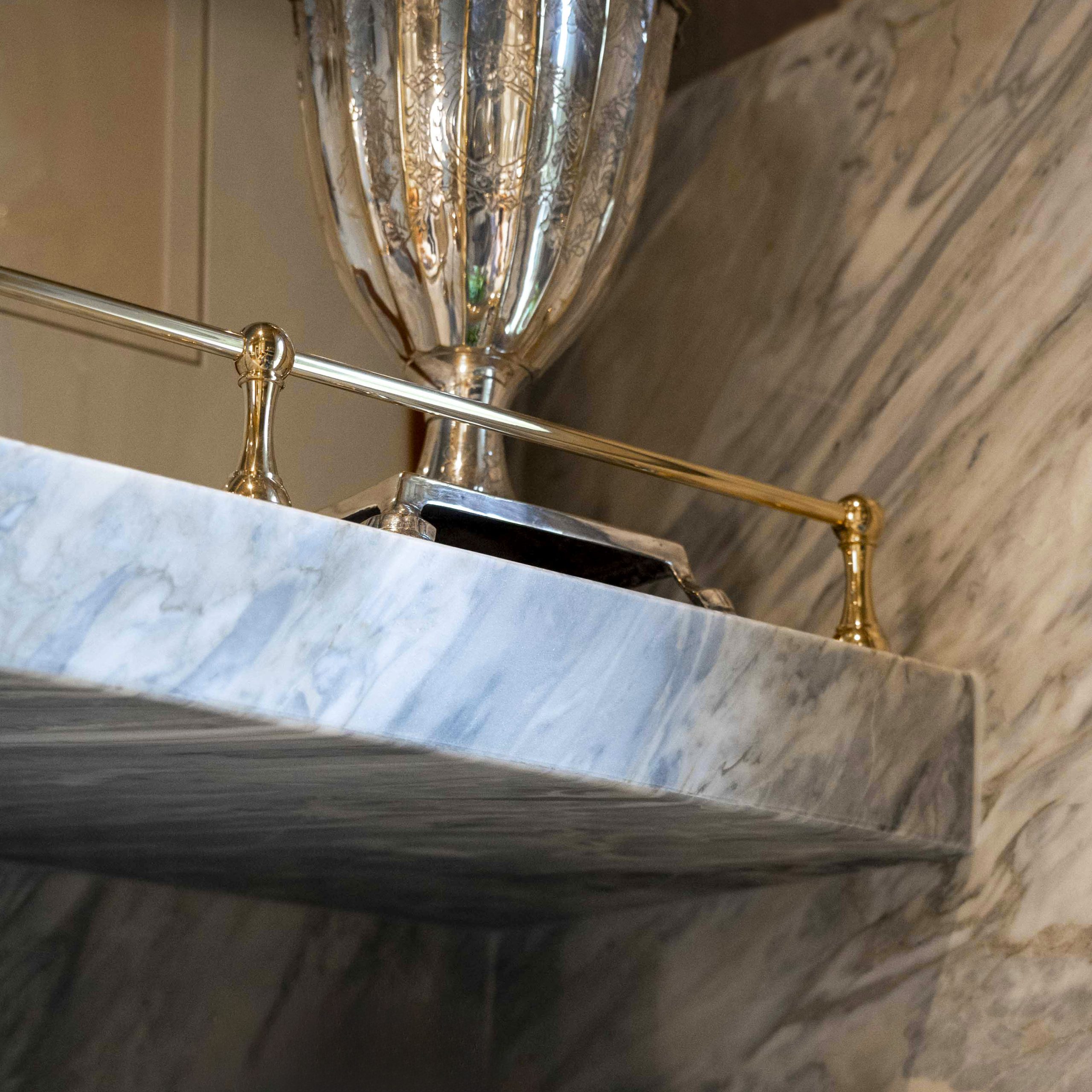 Traditional style Gallery Rails on marble shelves
