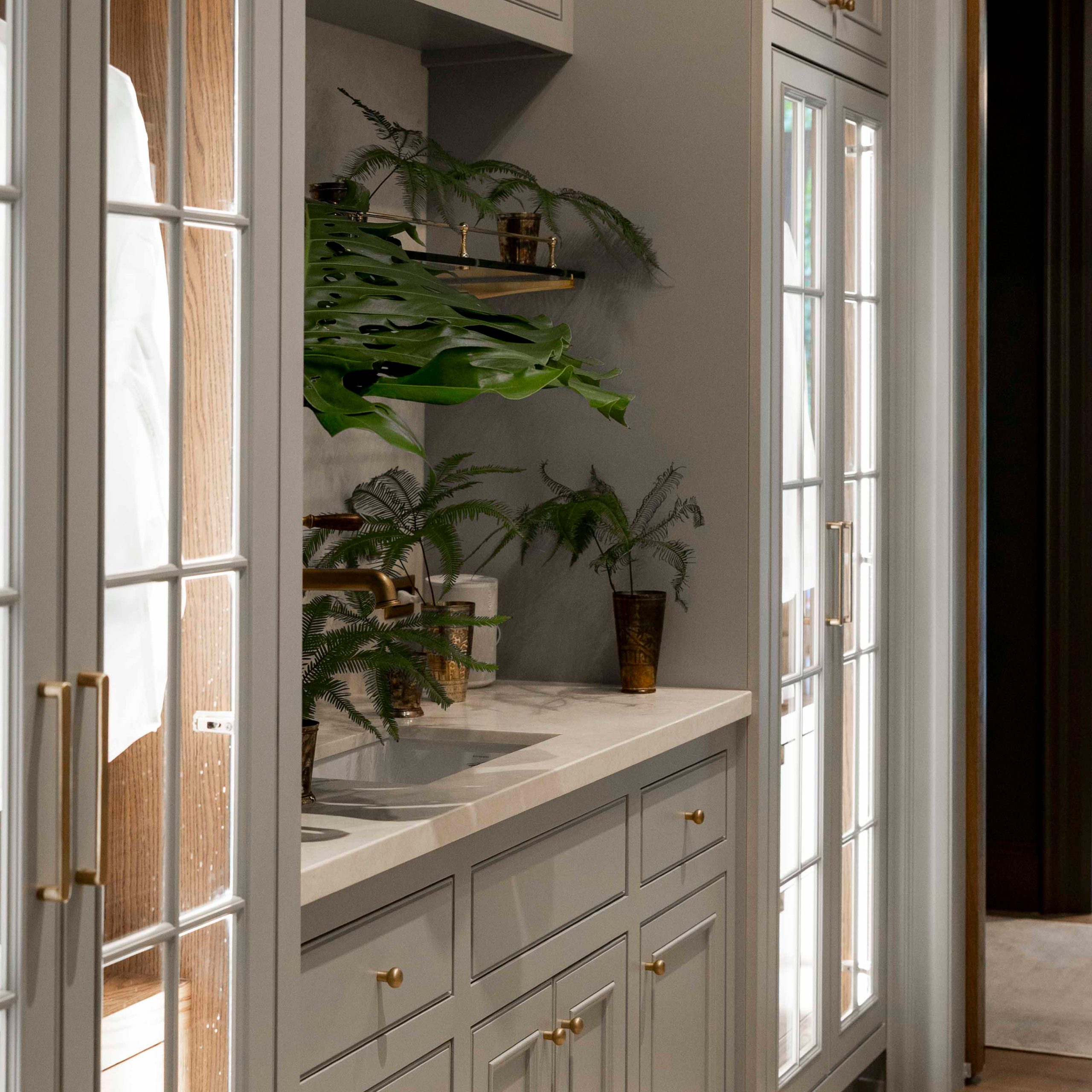 Rack style Cantilever Shelving Bracket with a glass shelf and Traditional style Gallery Rail in brass