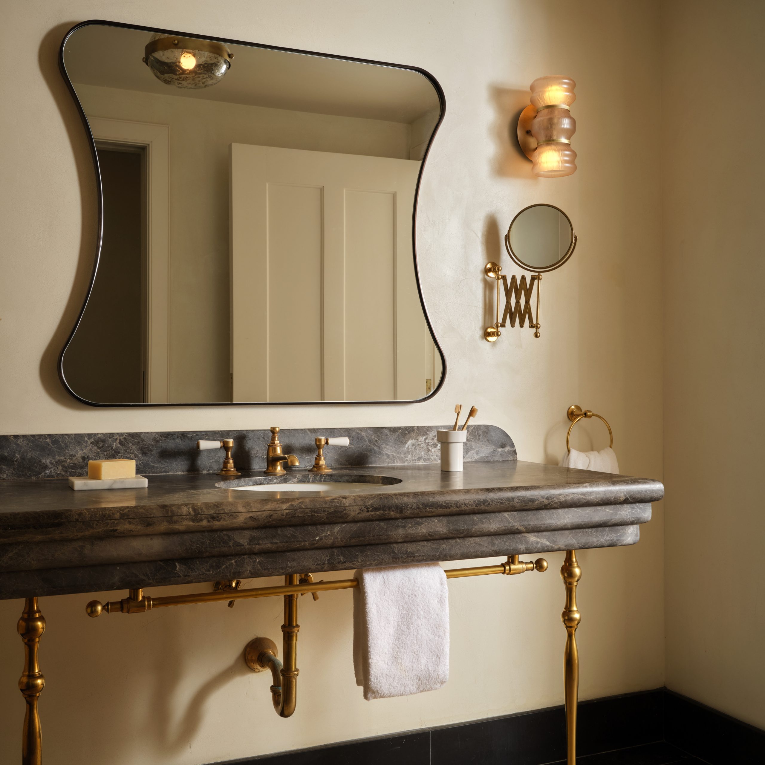 Soho style Vanity Leg System with a custom Studio style towel rack featuring Bistro style Finials