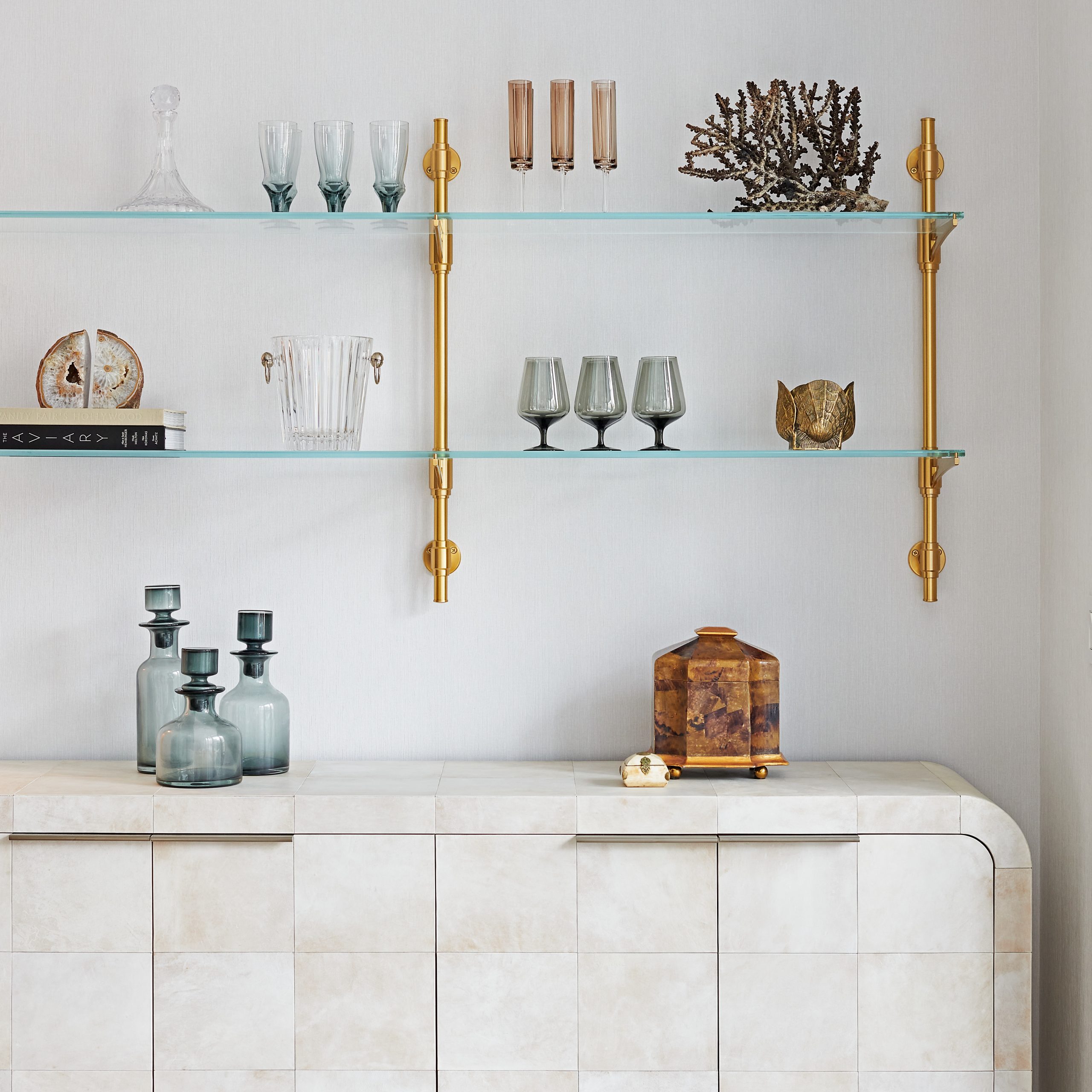 Wall-mounted Rack style Cantilever Designer Shelving in satin brass with glass shelves