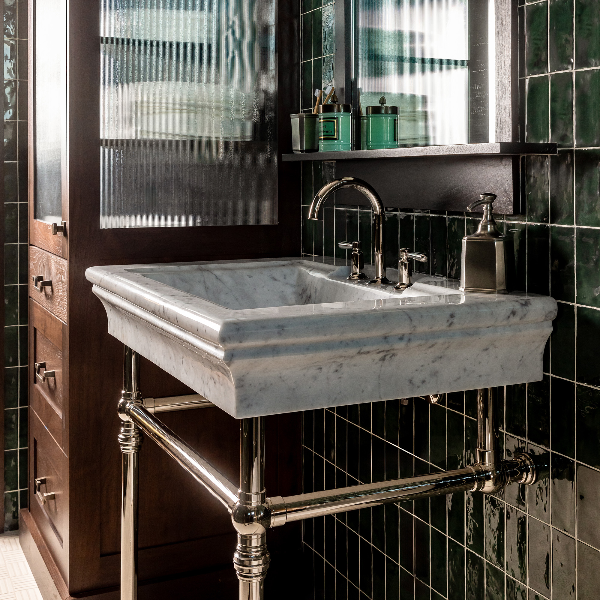 Decorative Collar style Vanity Leg System in polished nickel with a marble sinktop