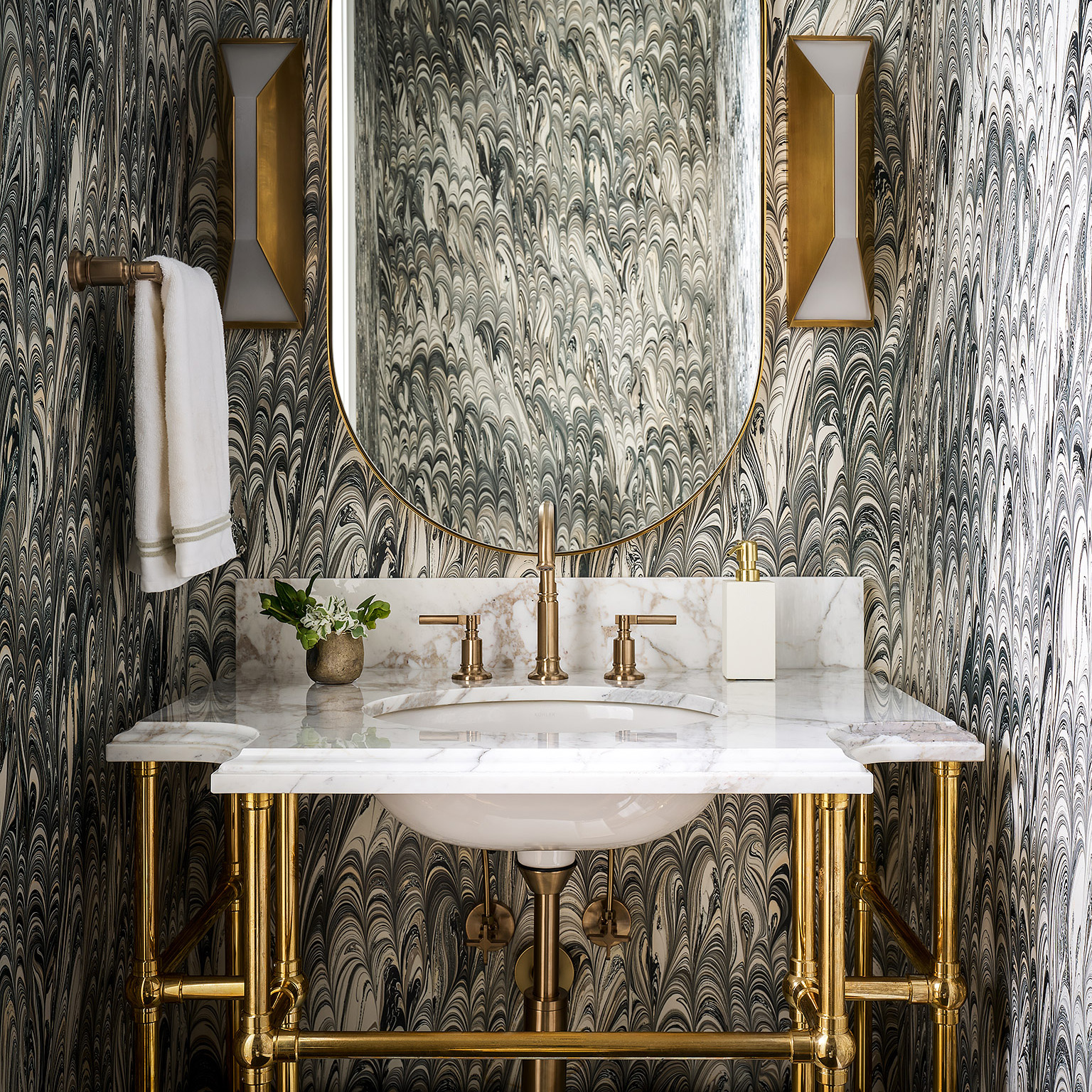 Custom designed Ball Style Vanity Leg System in polished brass with marble top