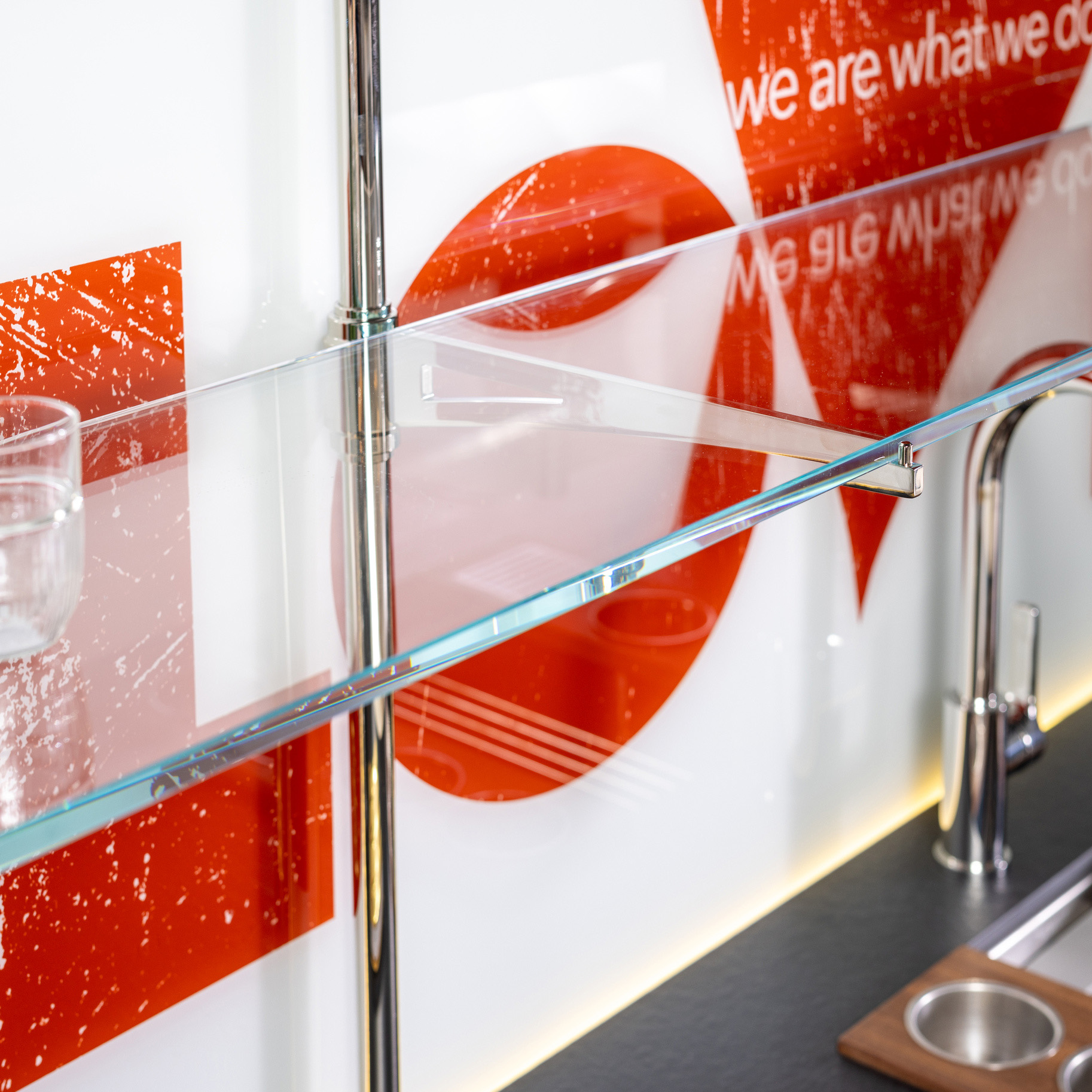 Detail of Rack style Cantilever Designer Shelving in polished nickel with glass shelves