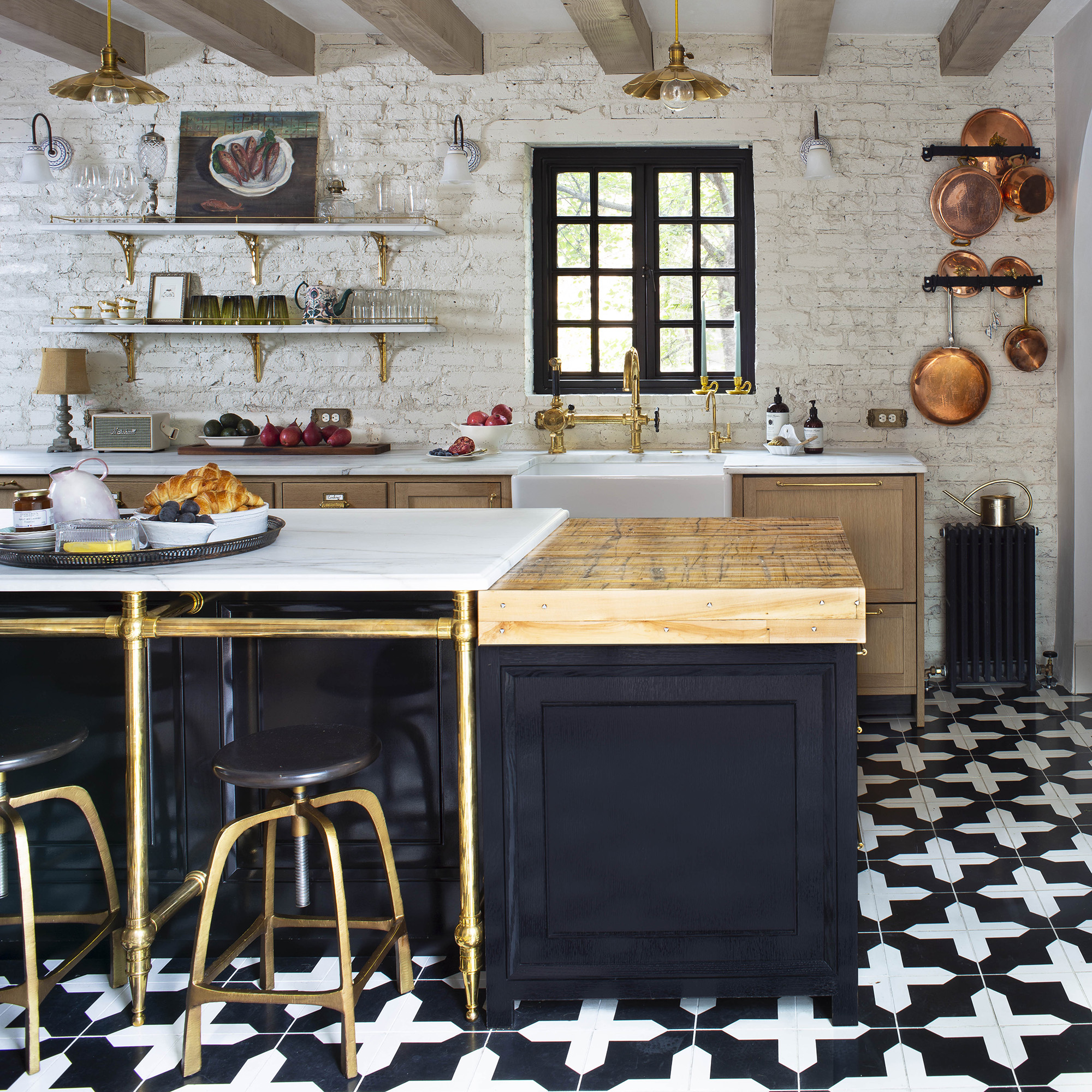 A Tapered Foot style Kitchen Leg System in polished brass supporting a countertop overhang