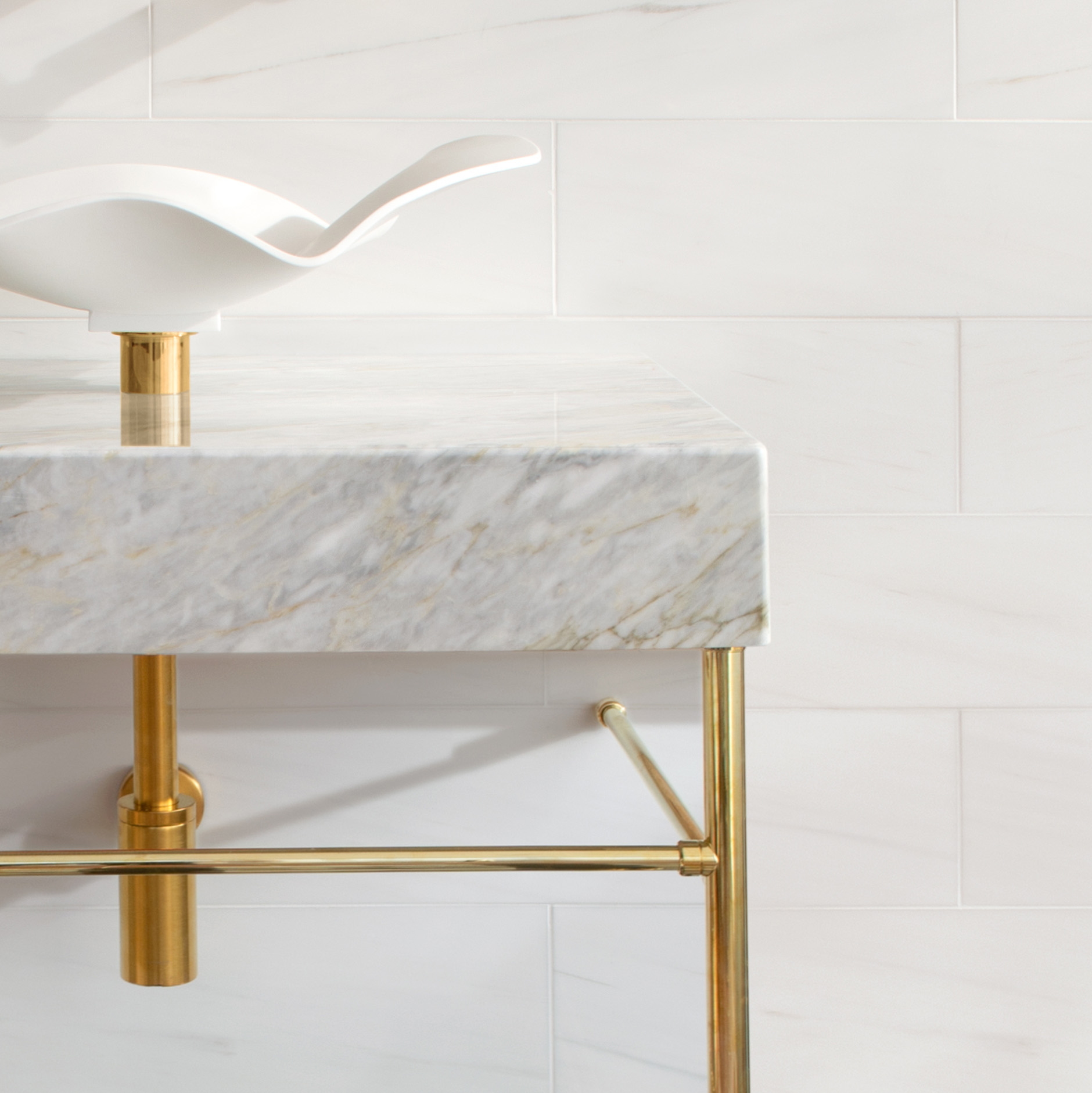 Metro style Vanity Leg System in satin brass with vessel sink