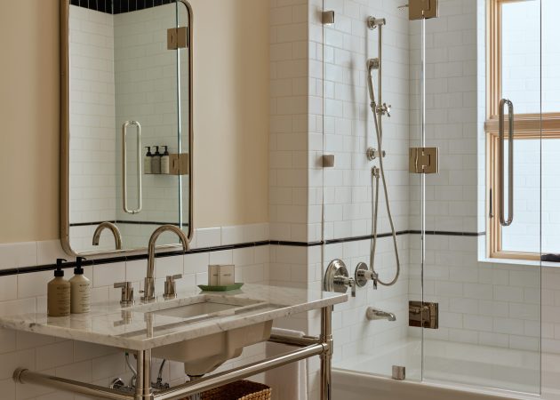 Studio style Vanity Sink Legs with tubular metal shelf in bathroom at the Belden House
