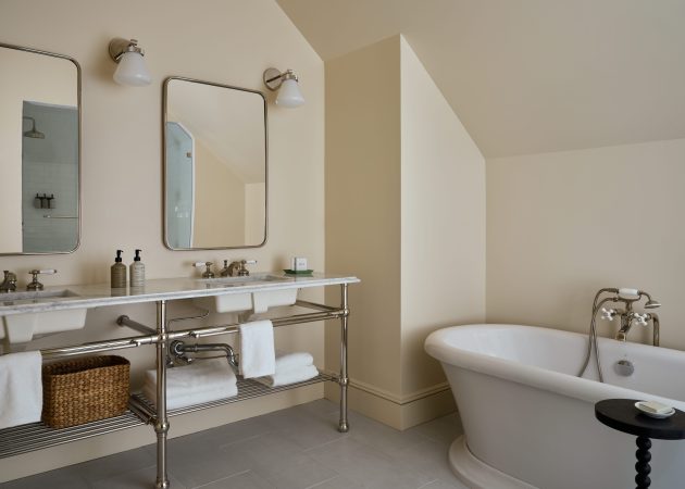 Ball Foot style Vanity Sink Legs with tubular metal shelf in bathroom at the Belden House