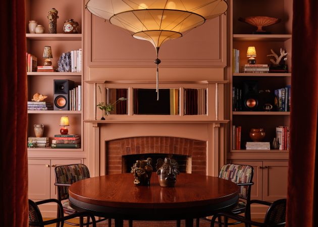 Room interior with table and fireplace at the Belden House
