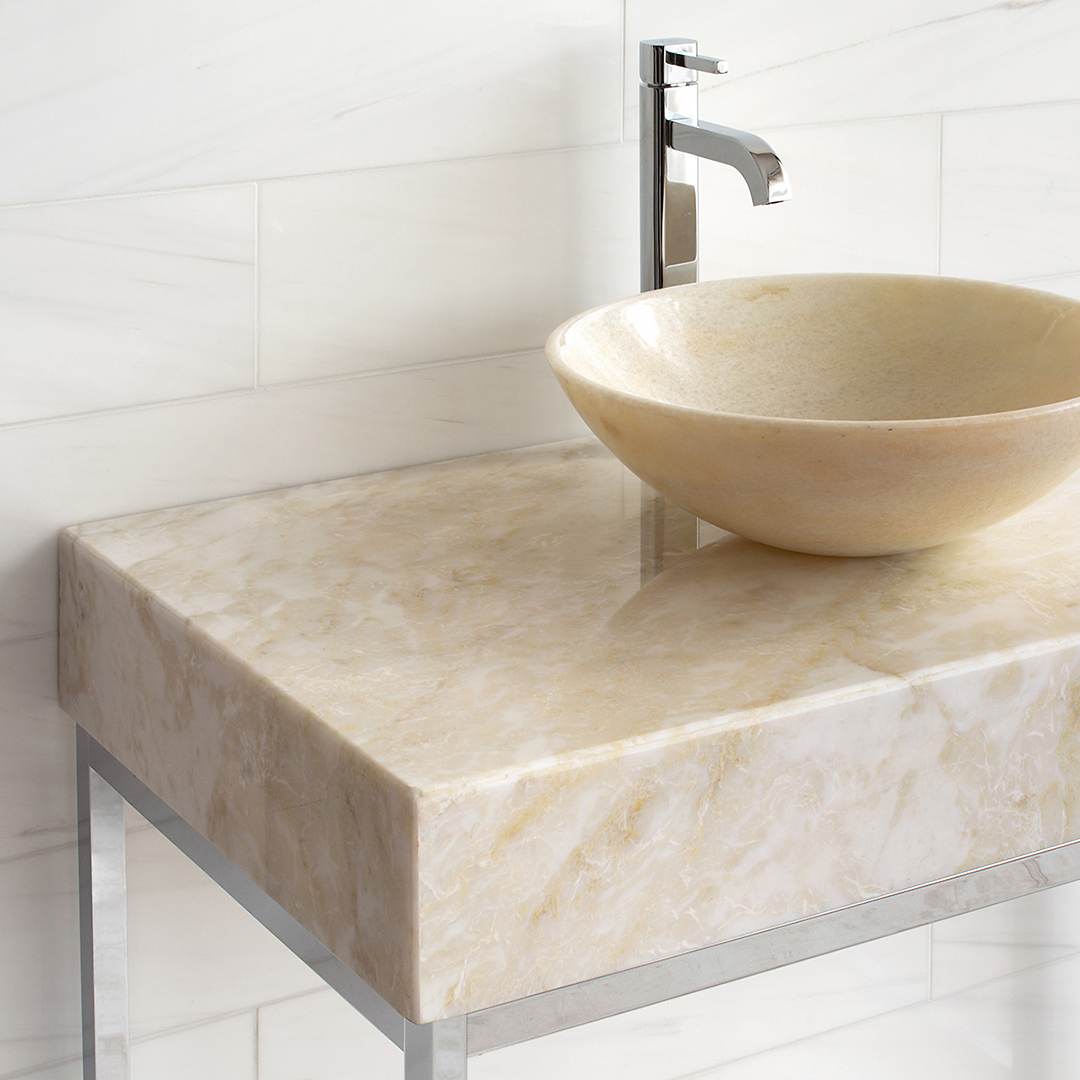 Linear style washstand in polished nickel with thick marble top and vessel style sink