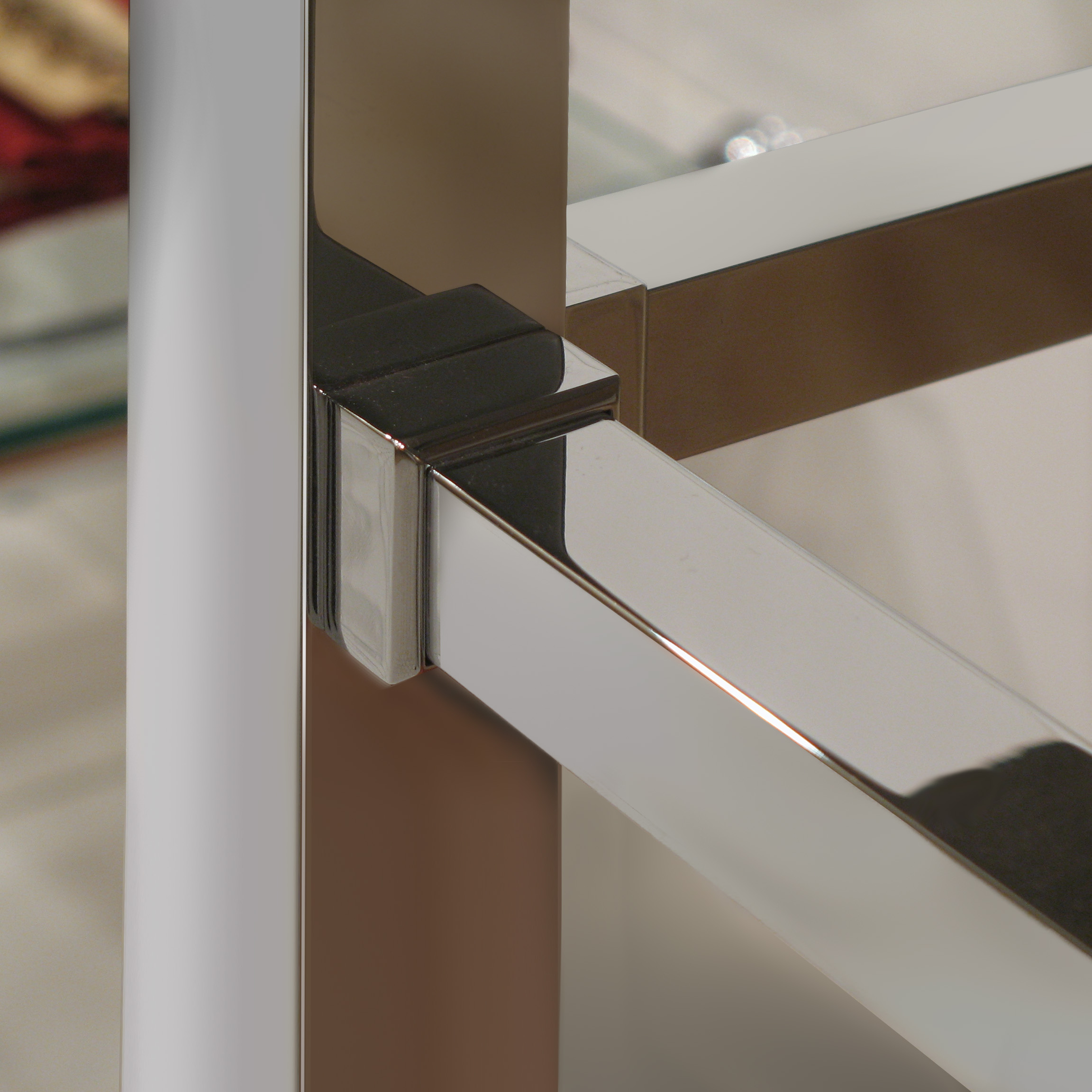 Detail of fitting connection on a Square style washstand in polished chrome